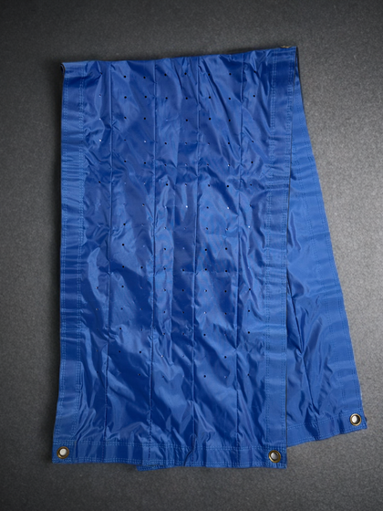 Thorair Water Containment Mat in blue with perforated design for effective liquid management